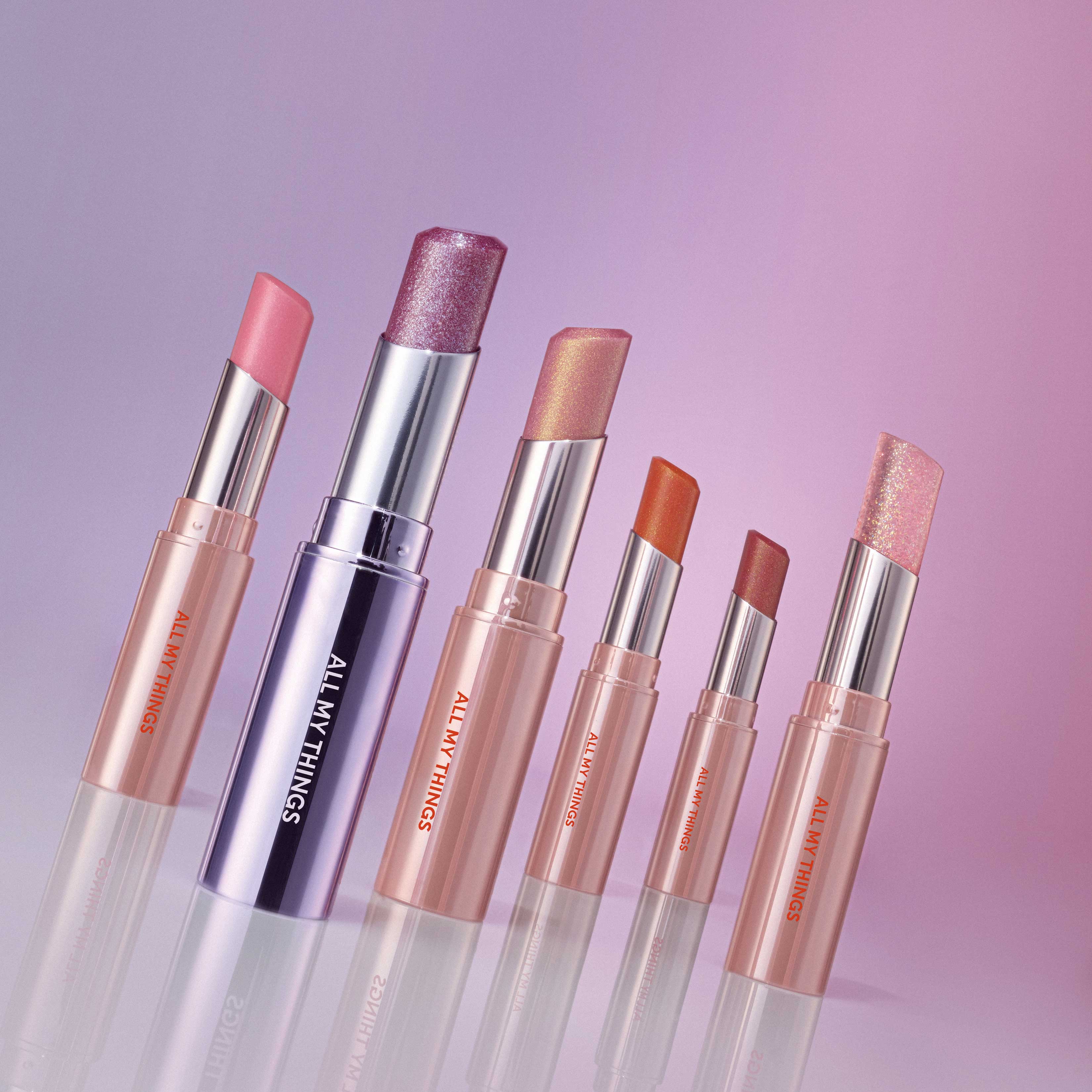 ALL MY THING I'm Your Lip Tint collection in various shades on a gradient background.