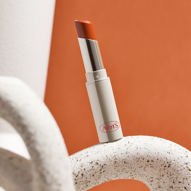 ALL MY THING I'm Your Lip Tint displayed on a textured surface with a vibrant background.