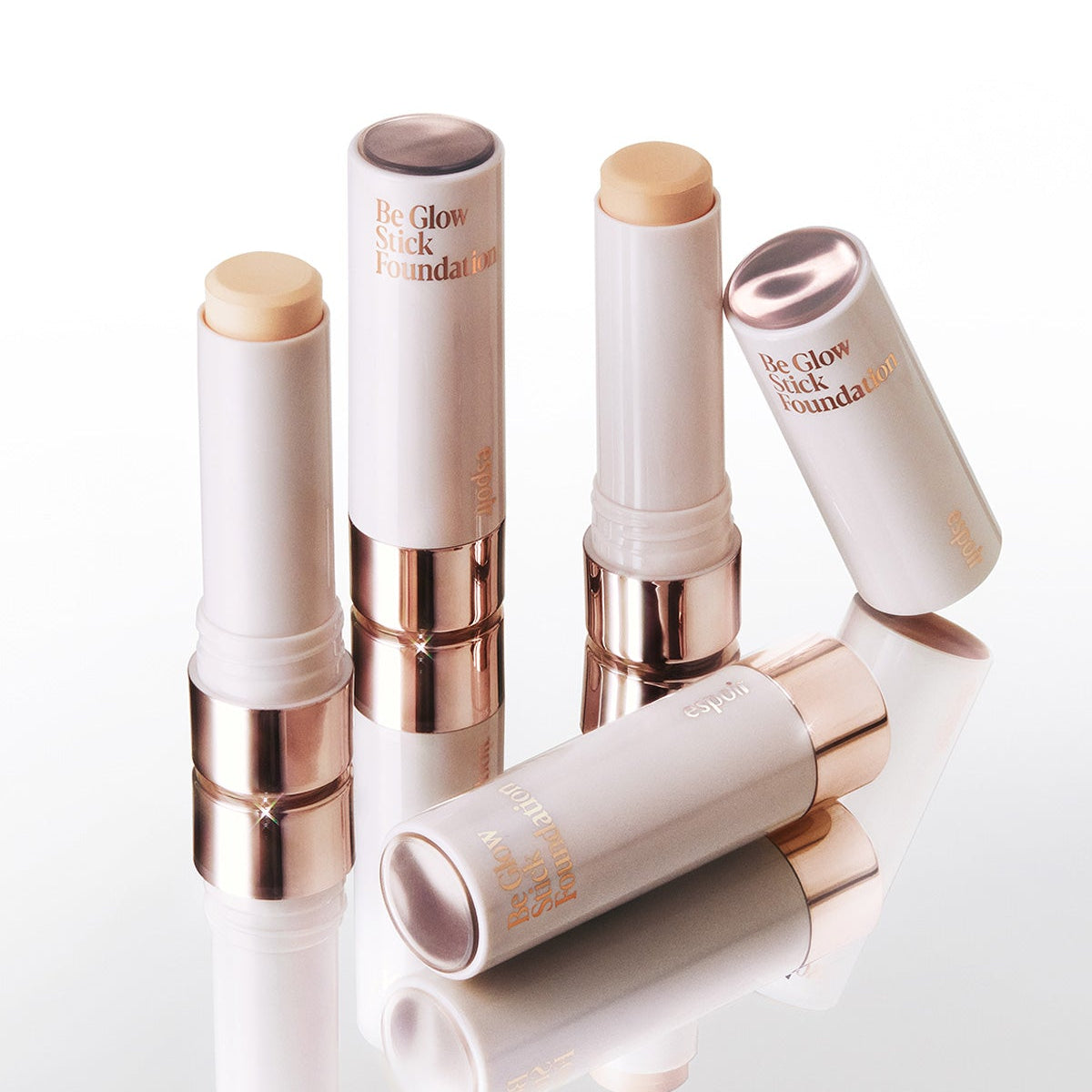 ESPOIR BE GLOW STICK FOUNDATION SPF50+ PA++++ on display with packaging.