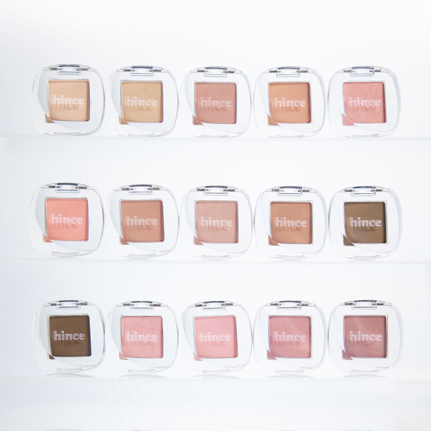 Collection of HINCE Single Eyeshadow colors in clear cases, showcasing a range of shades for versatile makeup looks.