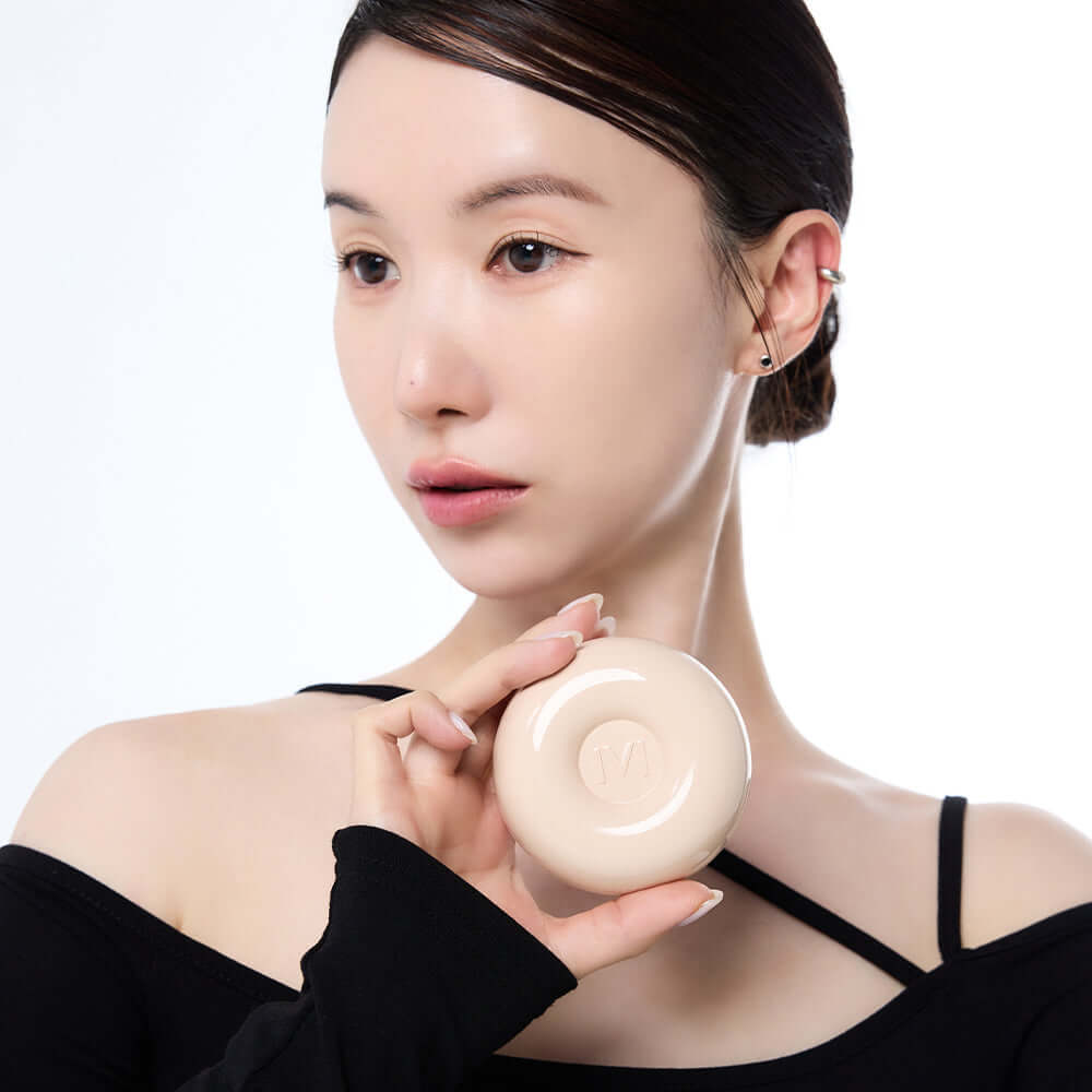 Person holding IVI MAD PEACH Plain Velvet Matte Cushion, showcasing its matte finish and design.
