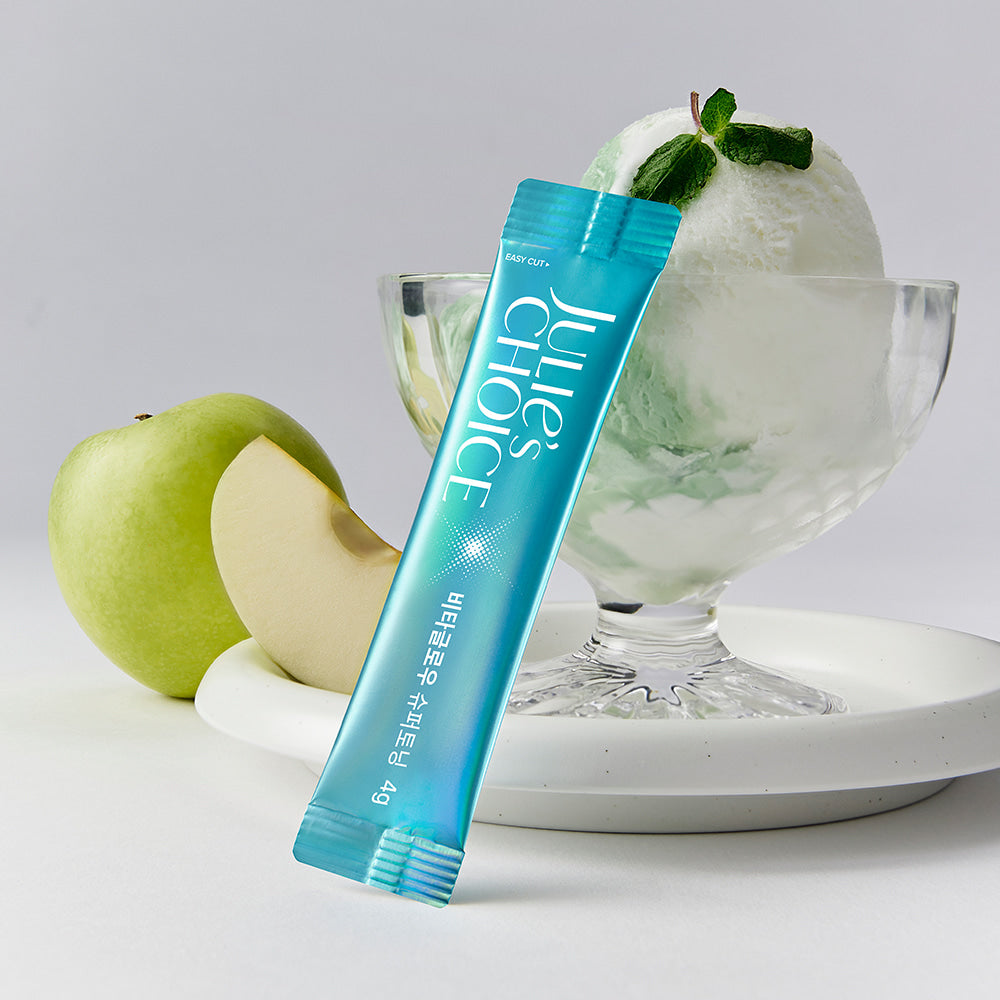 JULIE'S CHOICE Vita Glow Super Toning sachet with a green apple and dessert in background