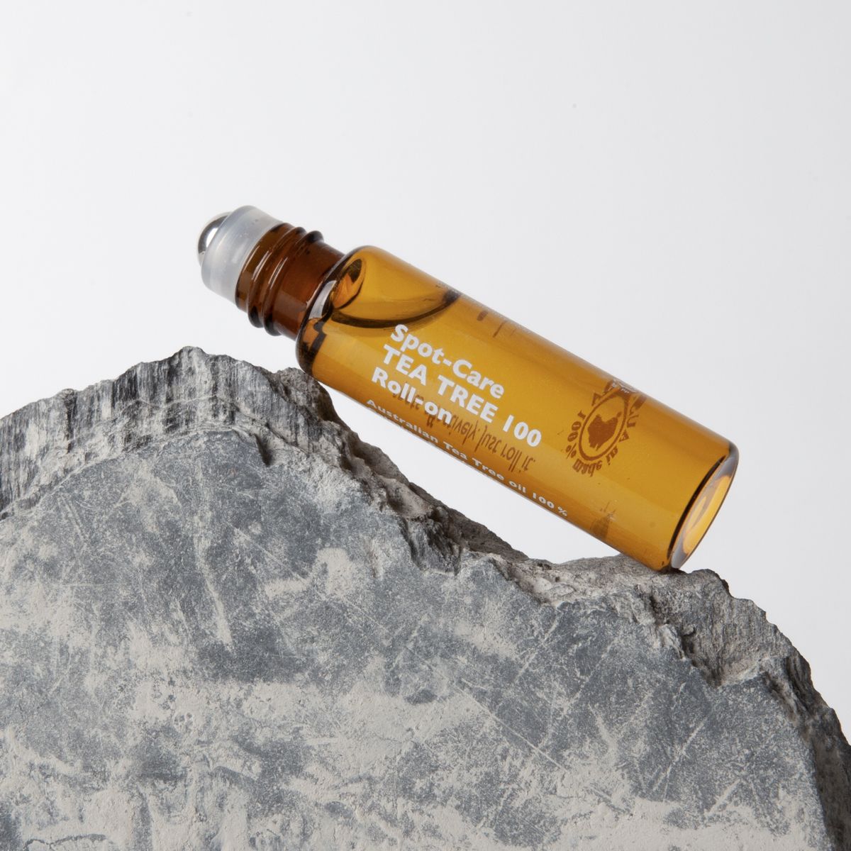 LAZY SOCIETY Spot Care Tea Tree 100 Roll on 5.5ml on stone prop, Korean skincare for men by Gentleman Korea