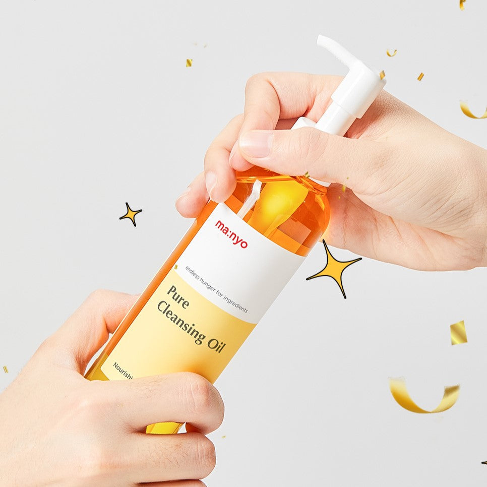 Hands holding a bottle of MA:NYO Pure Cleansing Oil, a skincare product with a pump dispenser, against a light background.