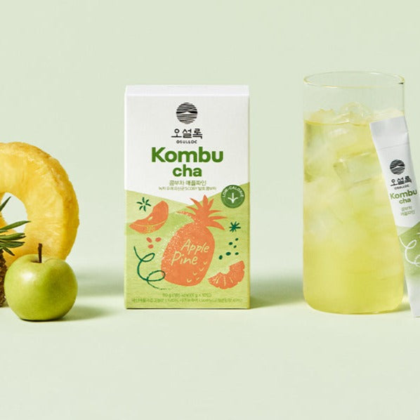 OSULLOC Kombucha Apple Pine flavor package with ice-cold glass and fresh fruits on display, highlighting health and freshness.