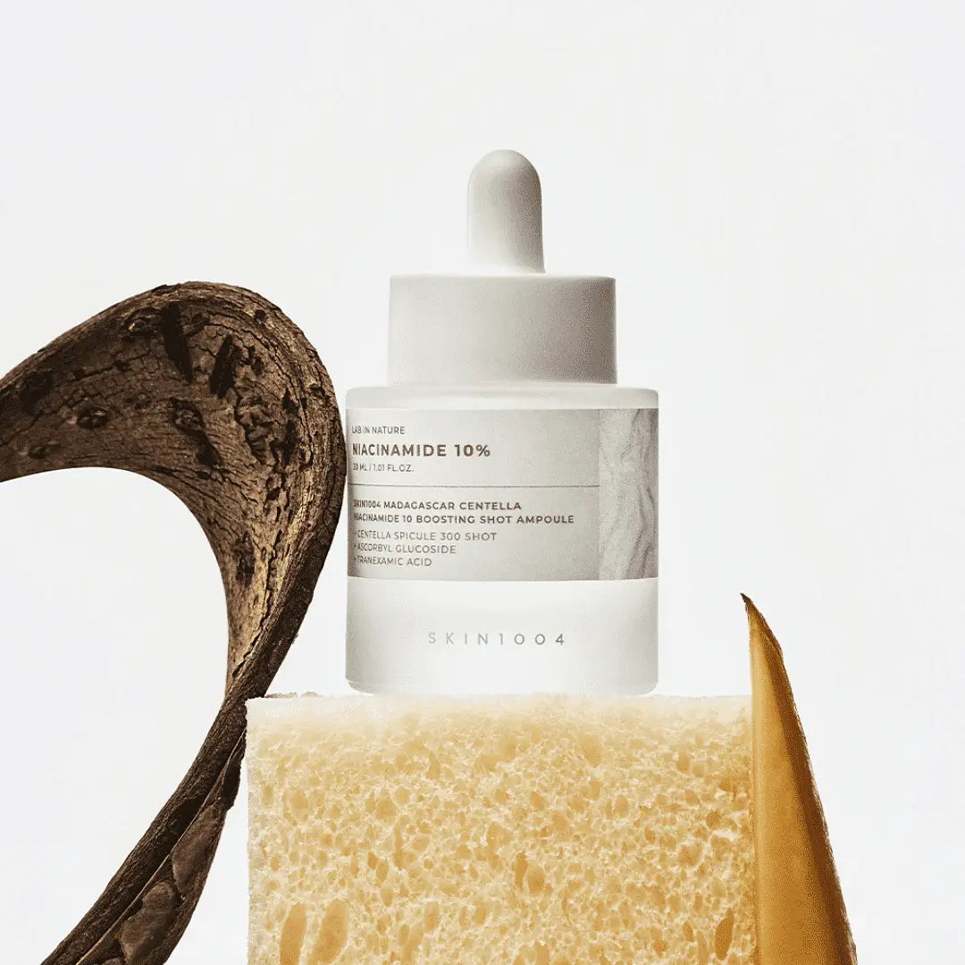 SKIN1004 Madagascar Centella Niacinamide 10 Boosting Shot Ampoule 30ml on display with natural elements