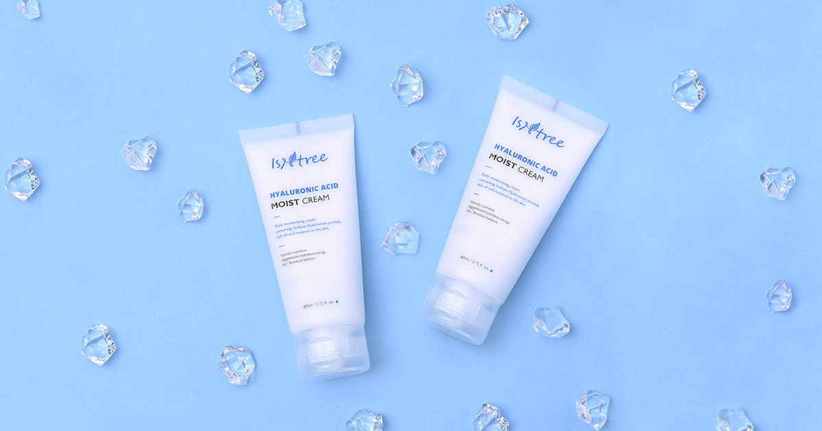 Exploring ISNTREE: A Korean Skincare Brand That Embraces Natural Beauty with hydrating creams on blue background with crystals.
