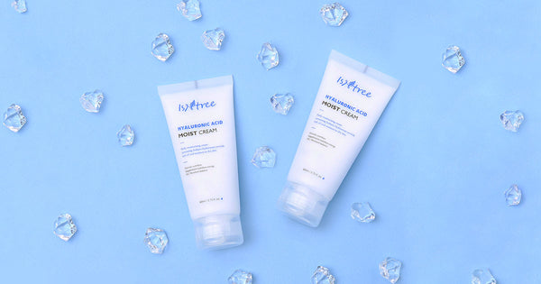 Exploring ISNTREE: A Korean Skincare Brand That Embraces Natural Beauty with hydrating creams on blue background with crystals.