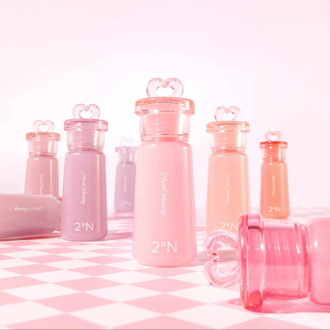 2AN Heart Wearing Liquid Cheek 4.4g bottles displayed in vibrant colors on a checkered surface
