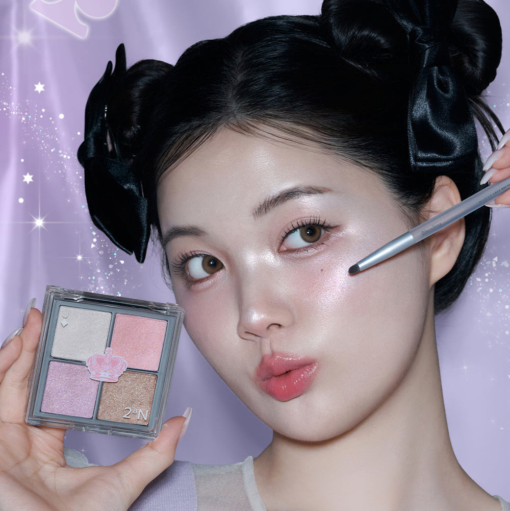 Model applying 2AN Jelly Glow Highlighter Palette 10.8g with makeup brush, showcasing shimmer effect on cheek.