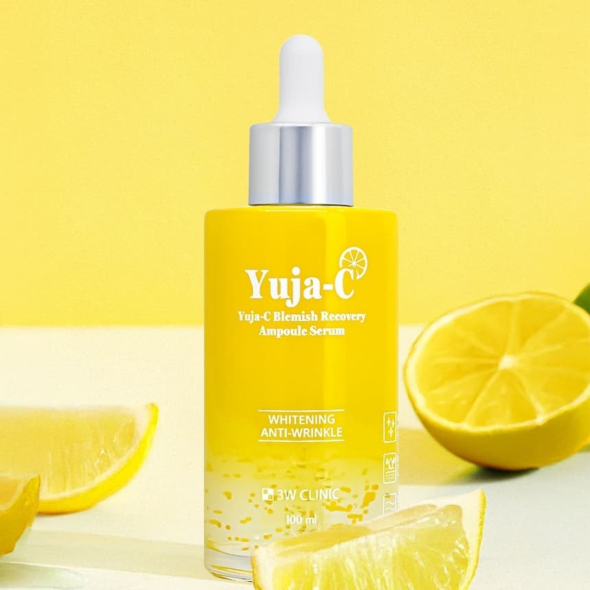 3W CLINIC Yuja C Blemish Recovery Ampoule Serum 100ml bottle with lemons on a yellow background