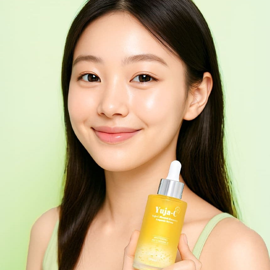 Woman holding 3W CLINIC Yuja C Blemish Recovery Ampoule Serum 100ml bottle