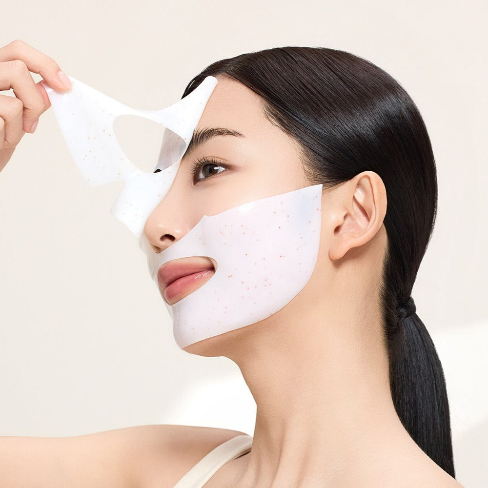 Woman applying ACWELL Licorice pH Balancing Real Toning Capsual Mask Sheets 4ea on her face