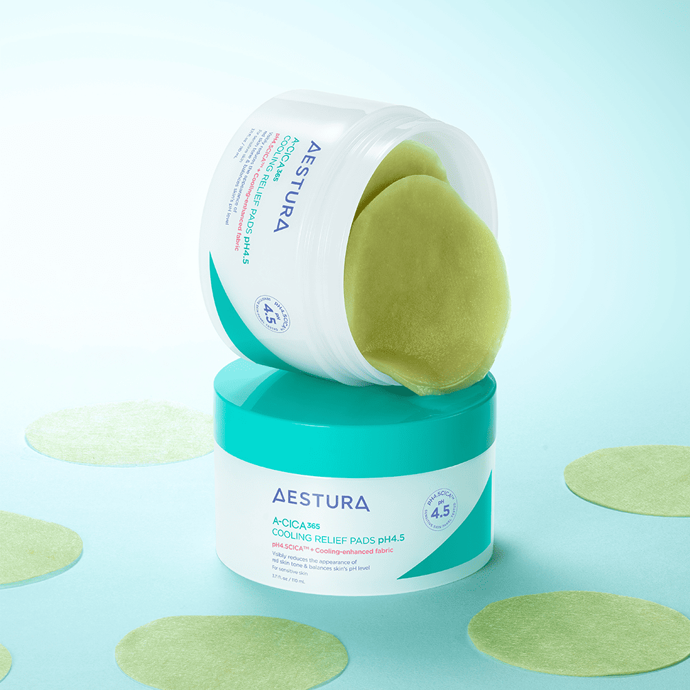 AESTURA Acica 365 Cooling Relief Pad pH 4.5 110ml (60 sheets) for soothing skin, shown in open container with pads exposed on blue surface.