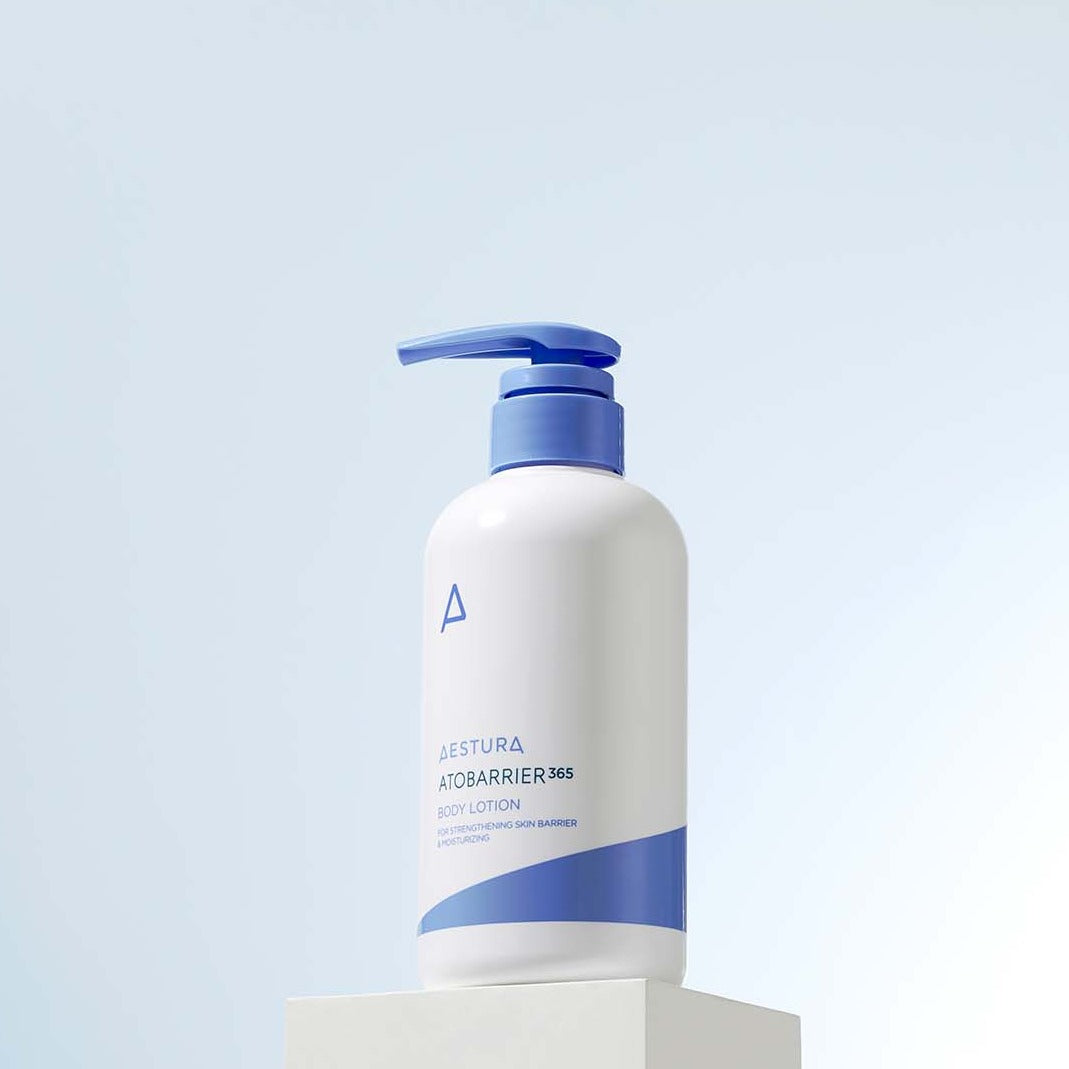 AESTURA Atobarrier 365 Body Lotion 400ml bottle on display against a light blue background.