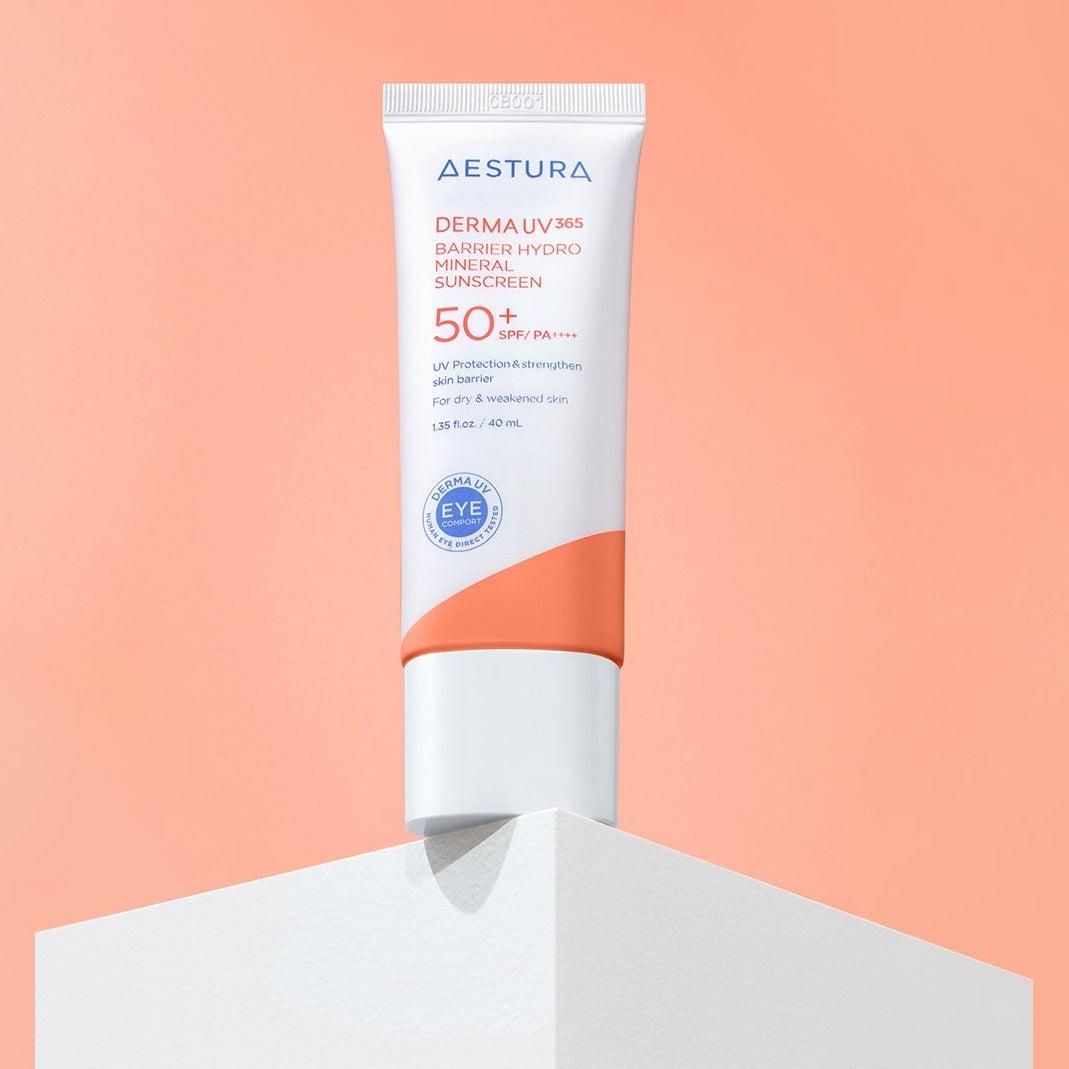 AESTURA Derma UV365 Barrier Hydro Mineral Sunscreen 40ml on display against a peach background showcasing SPF 50+ protection labeling.