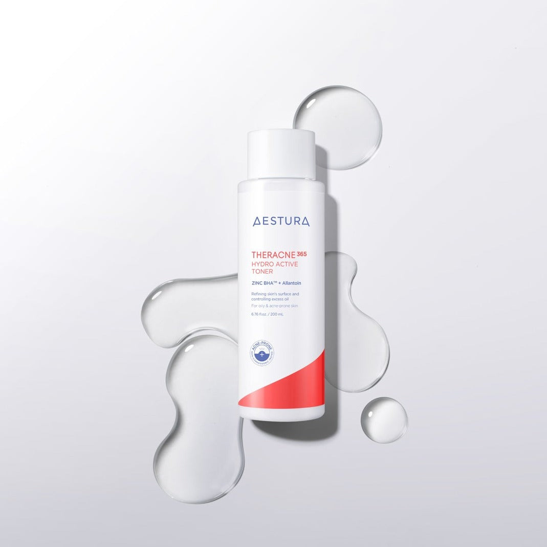 Bottle of AESTURA Theracne 365 Hydro Active Toner 200ml with liquid splashes around on a white background.