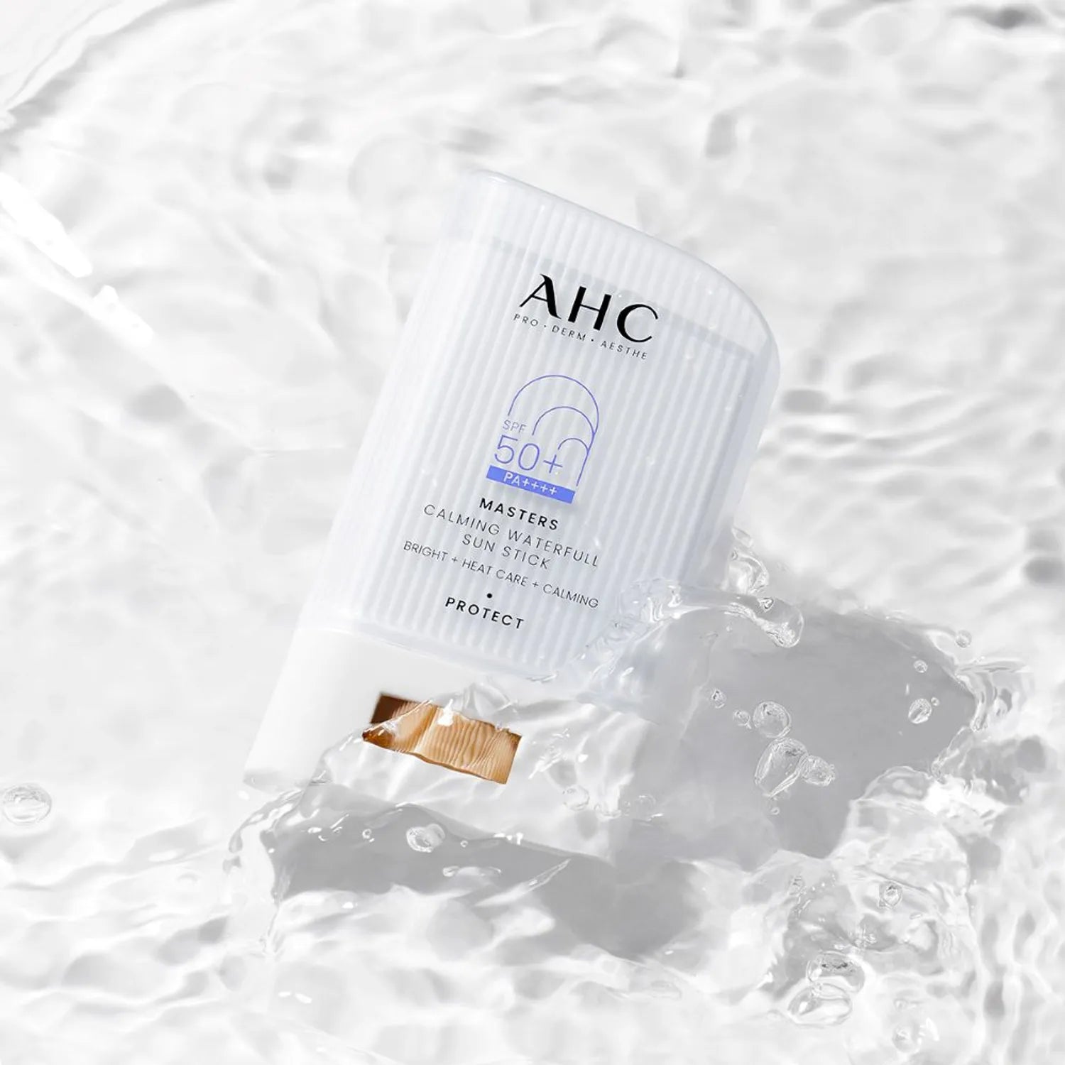 AHC Masters Calming Waterfull Sun Stick 22g on rippling water surface