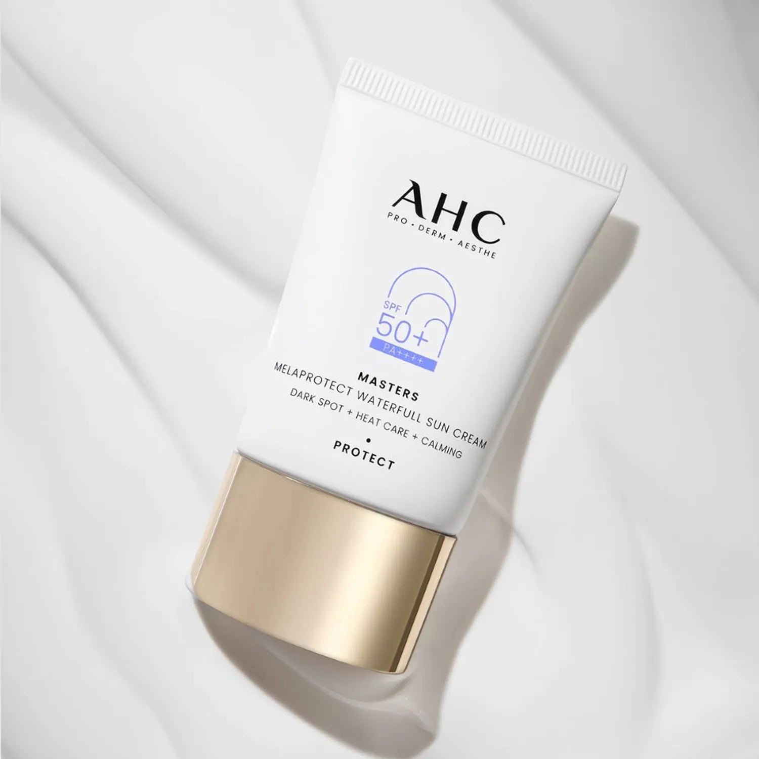 AHC Masters Mela Protect Waterfull Sunscreen 40ml tube against a soft background, showcasing SPF 50+ protection and premium packaging.