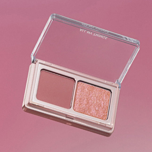 ALL MY THING Aurora Eyeshadow in a dual-tone palette with shimmering and matte shades on a pink background.