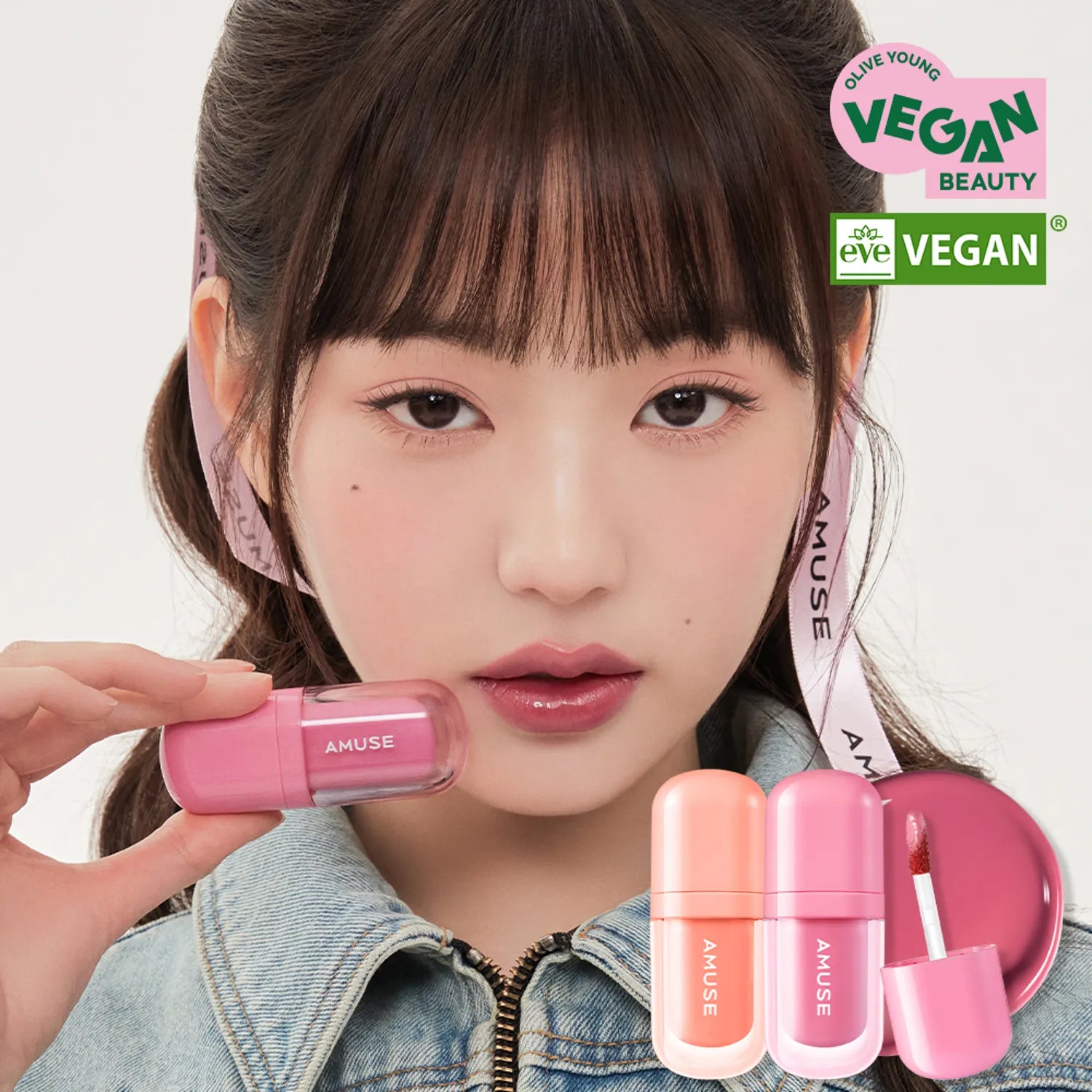AMUSE BEBE TINT vegan beauty product in pink shades, showcased by a model for a fresh and natural look, with eco-friendly certification.