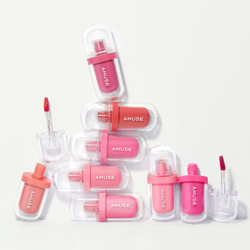 AMUSE Jel-Fit Tint collection of vibrant pink and coral lip tints, displayed in clear cases.