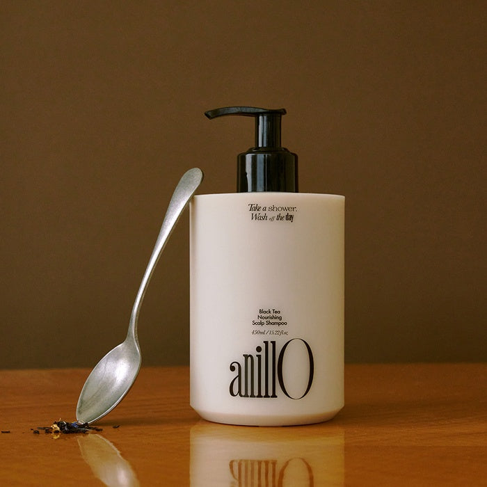 ANILLO Black Tea Nourishing Scalp Shampoo 450ml bottle with a spoon beside it.