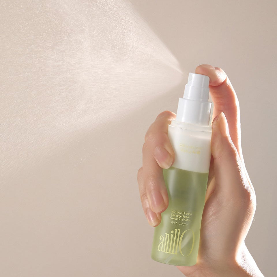 ANILLO Patchouli Garden Damage Repair Cream Hair Mist 70ml being sprayed