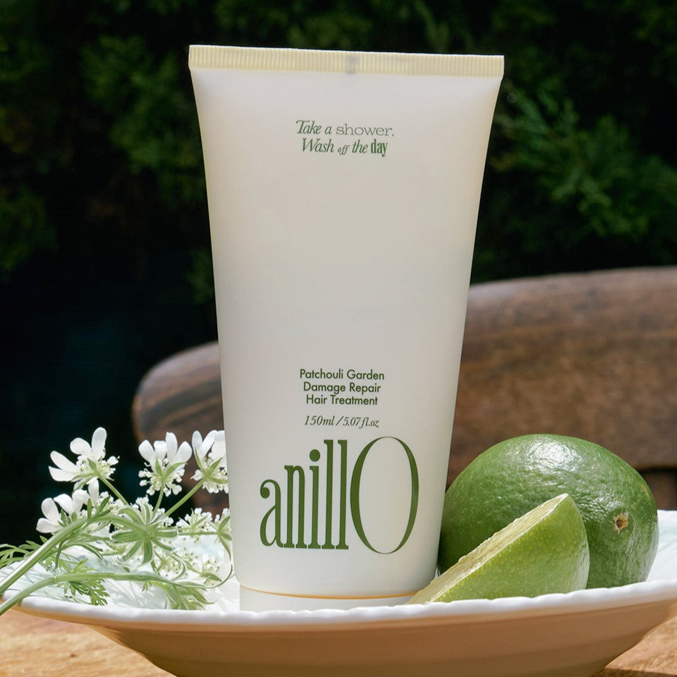 ANILLO Patchouli Garden Damage Repair Hair Treatment 150ml displayed with lime and flowers