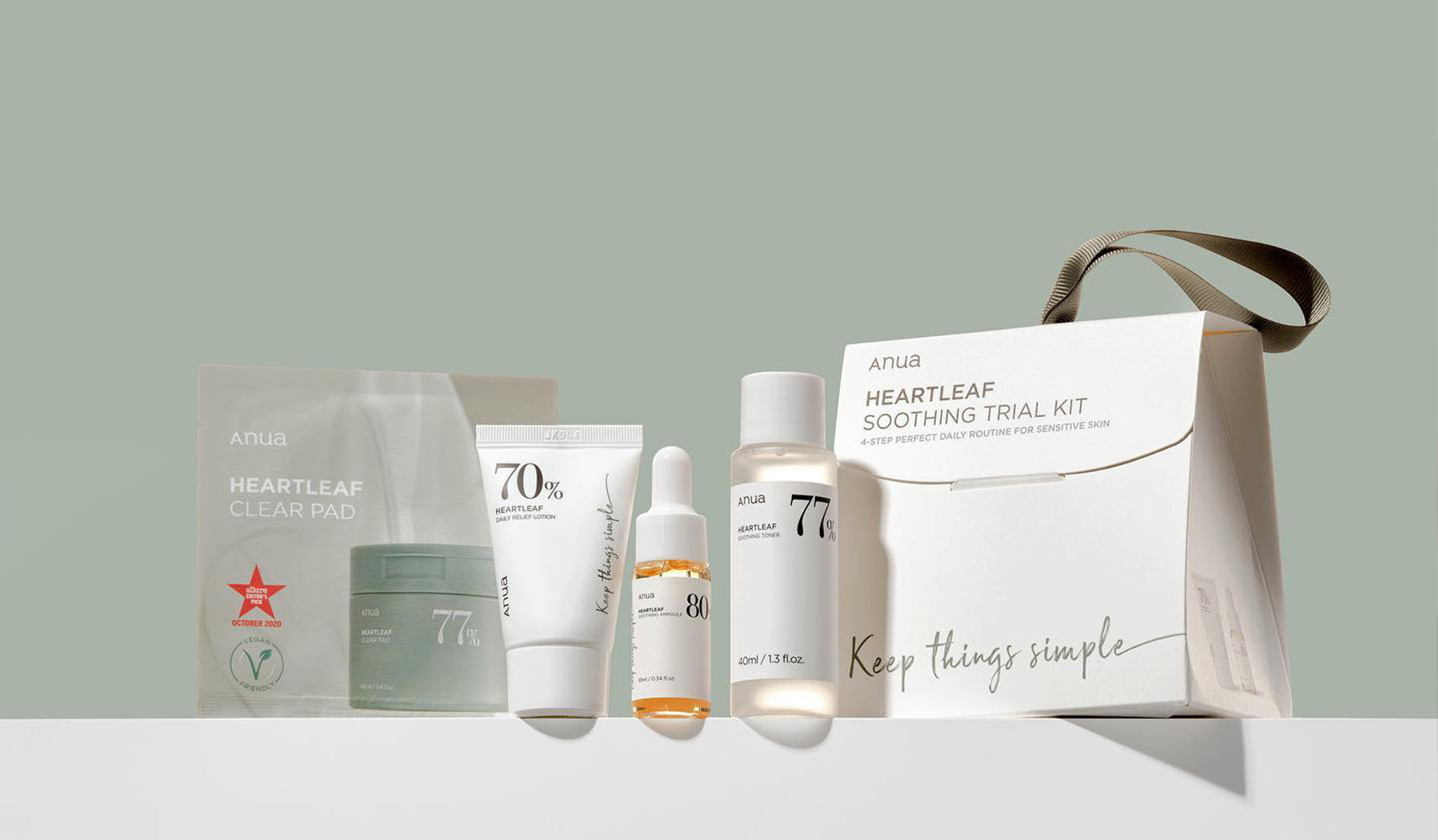 Heartleaf Soothing Trial Kit with clear pad, skincare products, and minimalist packaging on a light background.