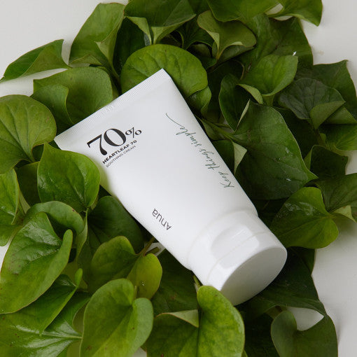 ANUA Heartleaf 70 Soothing Cream 100ml tube surrounded by green leaves