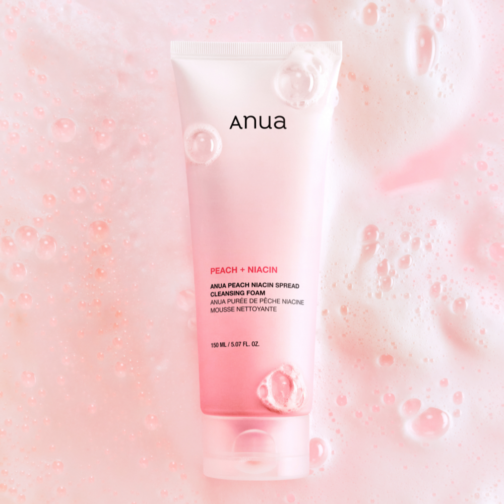 ANUA Peach Niacin Spread Cleansing Foam 150ml with pink bubbles background