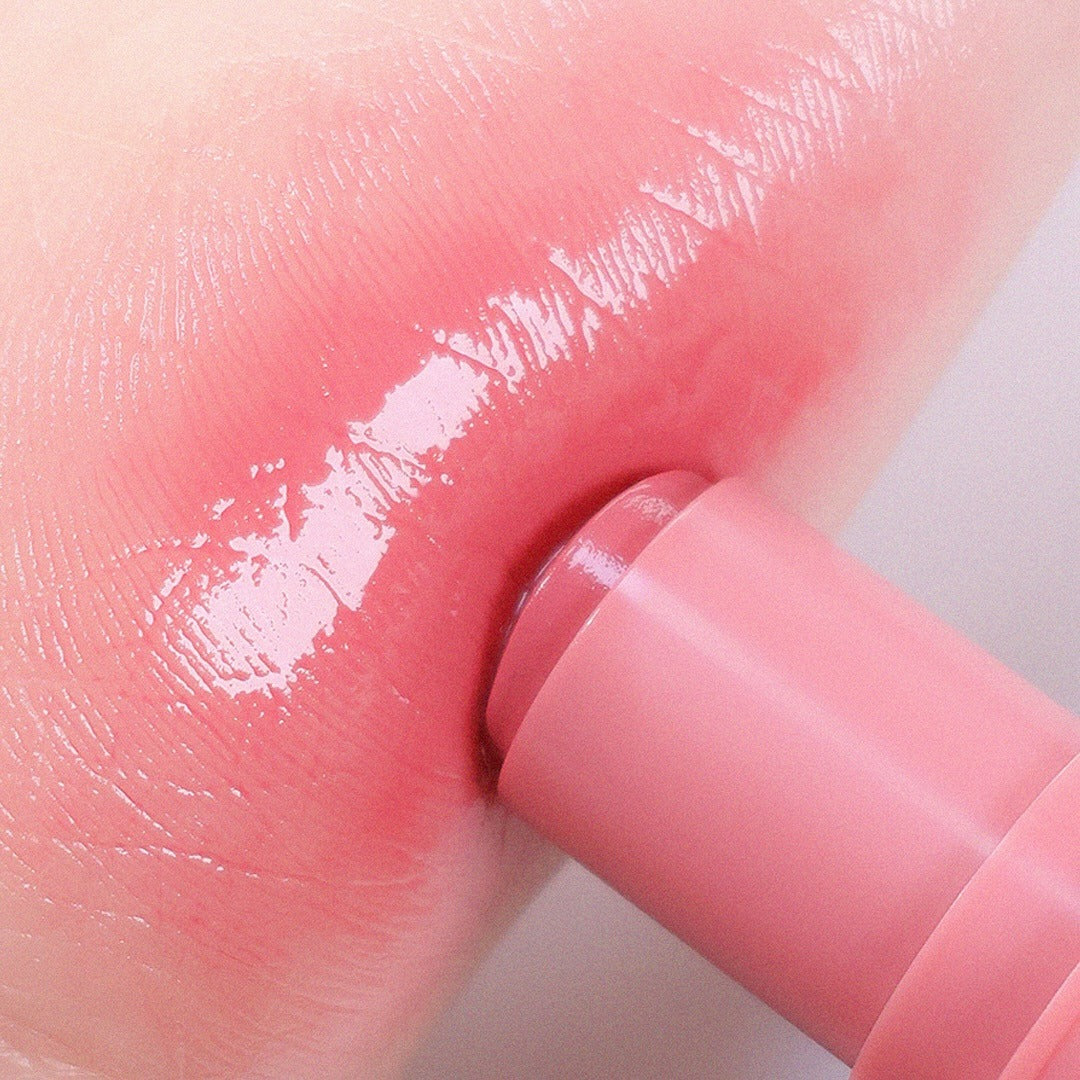 AOU Dewy Bar applied to lips for a glossy finish