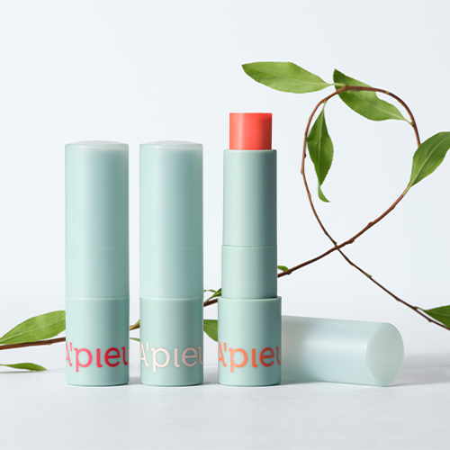 A'PIEU Juicy Pang Care Lip Balm in green packaging with floral accents.