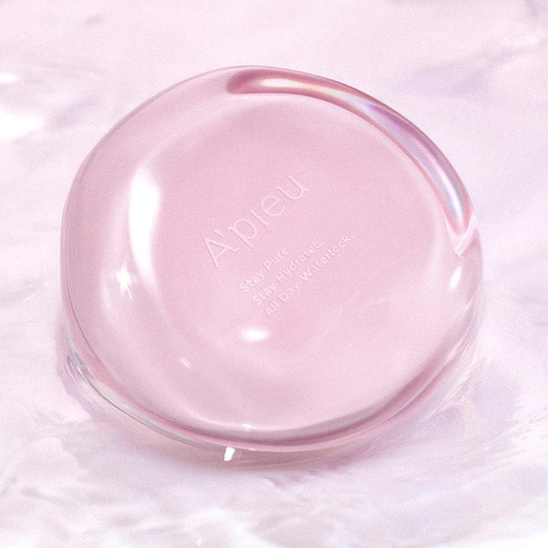 A'PIEU Waterlock Comfort Veil Cushion 15g in pink, floating on water, showcasing its sleek, reflective design.