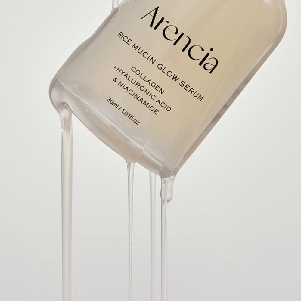 ARENCIA Rice Mucin Glow Serum 30ml bottle with serum flowing