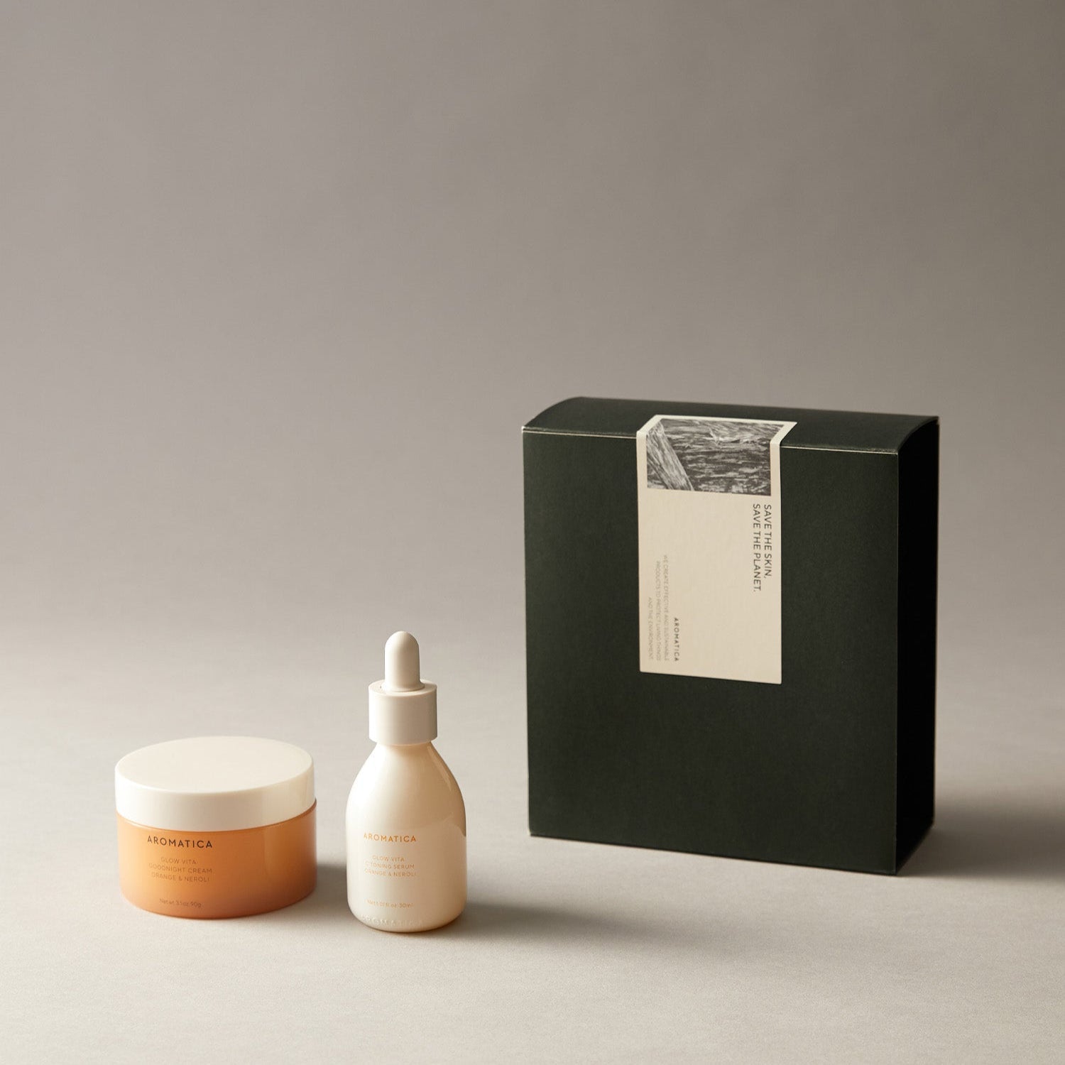 AROMATICA Glow Vita Toning Serum & Good Night Cream Set displayed with elegant packaging on neutral background