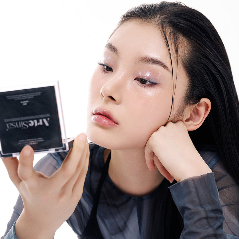 Person using ARTESINSA Unvoiced Eye Palettes, highlighting exquisite eyeshadow application and innovative makeup design.