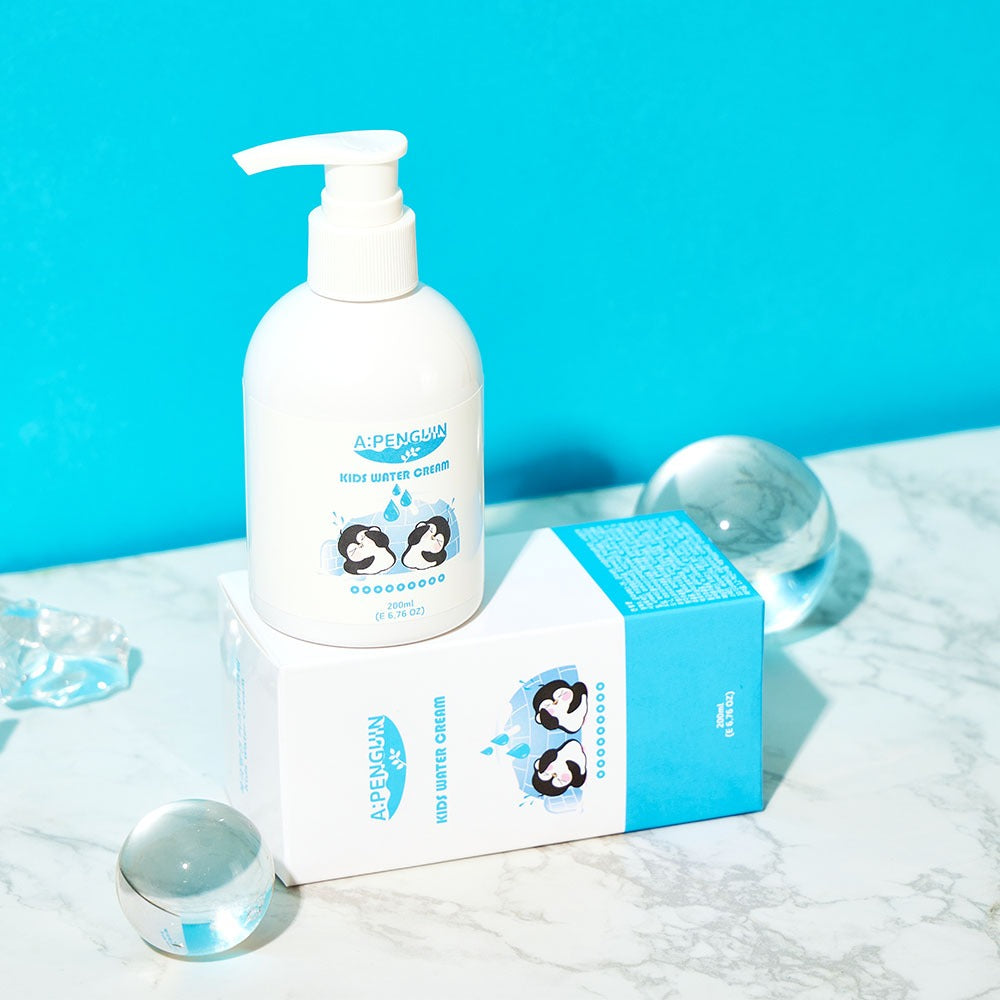 ATOMANDE Arctic Penguin Kids Children's Water Essence Moisture Cream Body Lotion 200ml on marble surface
