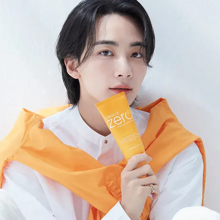 Person holding BANILA CO Clean It Zero Brightening Peeling Gel 120ml, showcasing skincare product packaging.