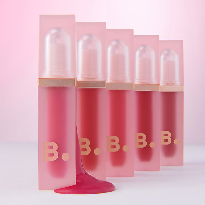 BANILA CO Water Drop Veil Tint in gradient pink shades, showcasing five sleek bottles with a pink liquid highlight.