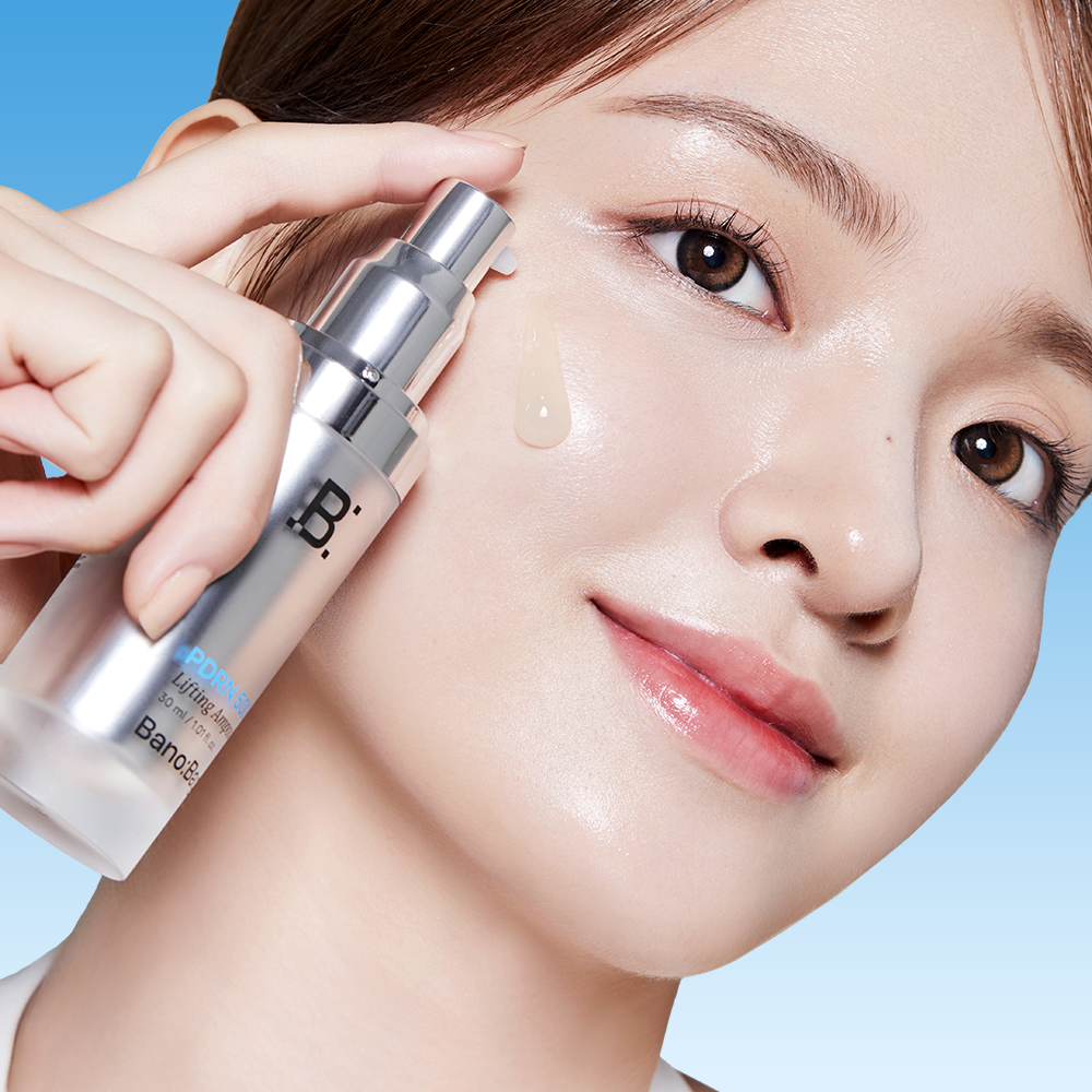 Woman applying BANOBAGI PDRN 500 Lifting Ampoule 30ml on face