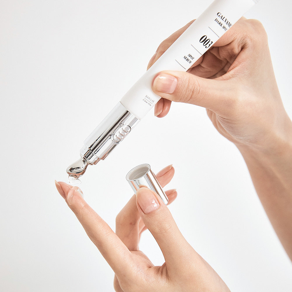 Applying BARULAB Galvanic Dark Spot Serum 20ml with precision applicator