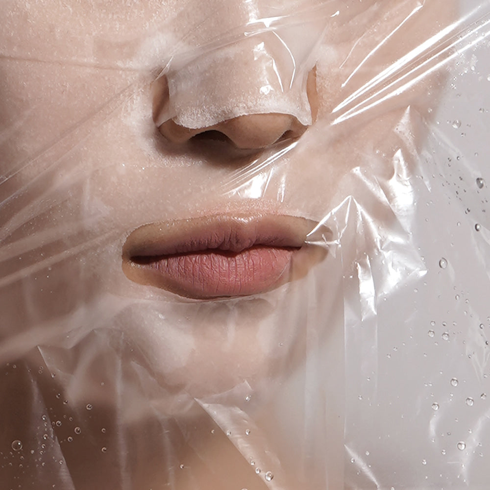 Close-up of BARULAB Steam Sheets Moisture Shield Oil Lock Facial Mask 5 Packs on skin for hydration and moisture lock.