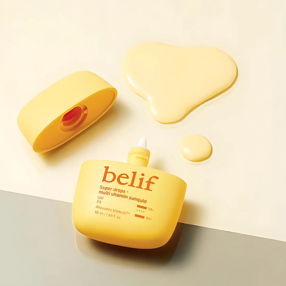 BELIF Super Drops Multivitamin Sunquid 50ml bottle with open cap and liquid next to it on a light background.