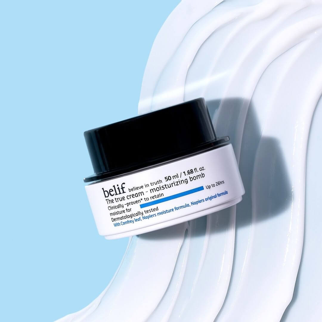 BELIF The True Cream Moisturizing Bomb 50ml on a smooth cream texture background