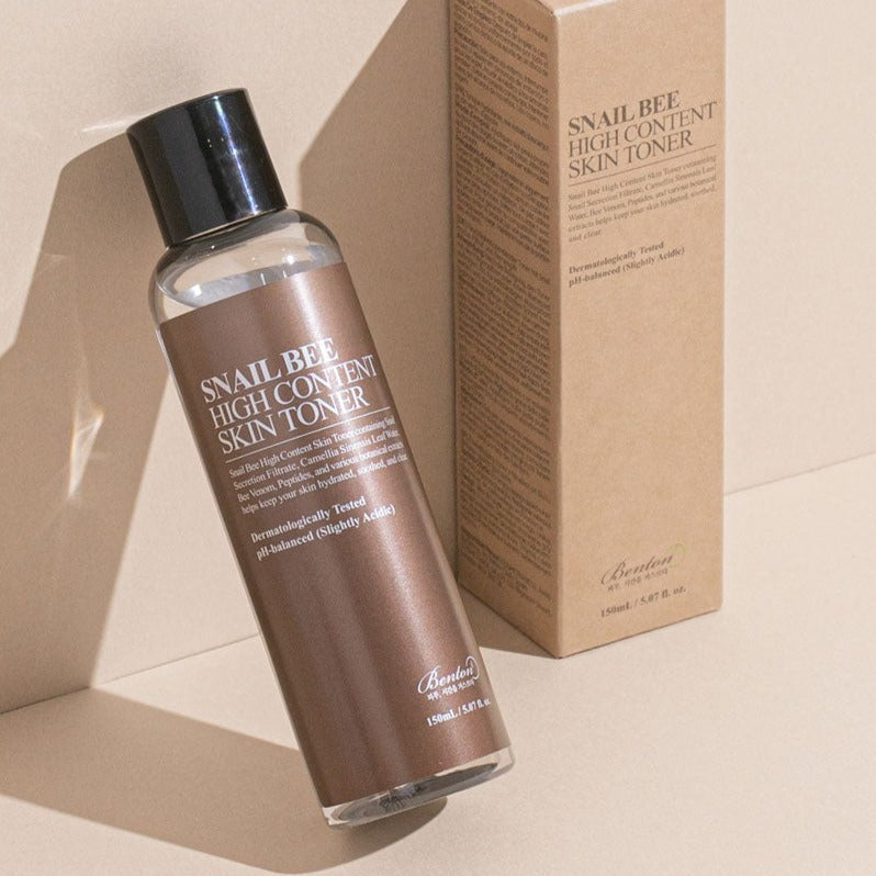 BENTON Snail Bee High Content Skin Toner 150ml with packaging on beige background