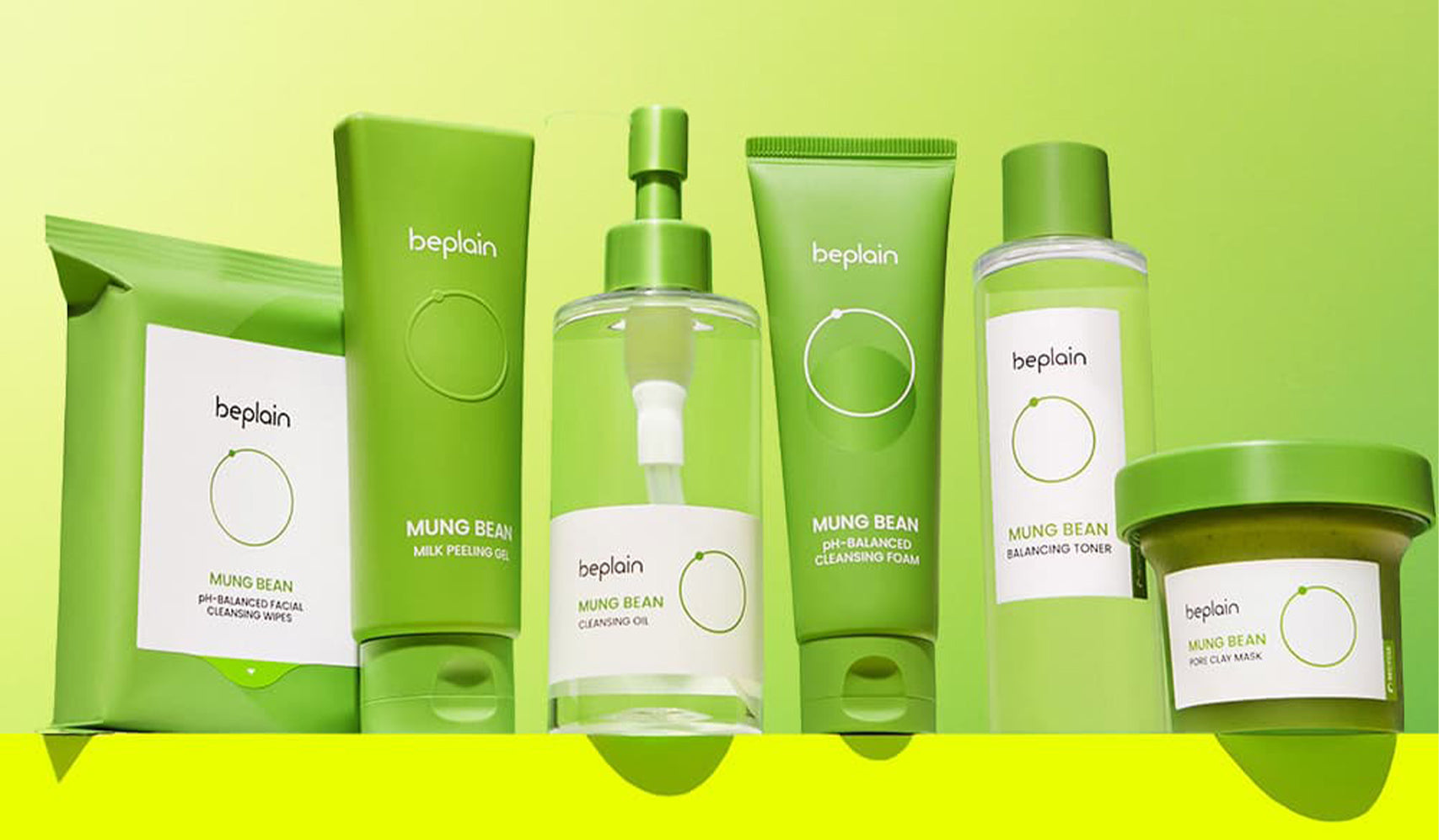 beplain Mung Bean skincare products set on a green background, featuring cleansing oil, toner, and facial packs.