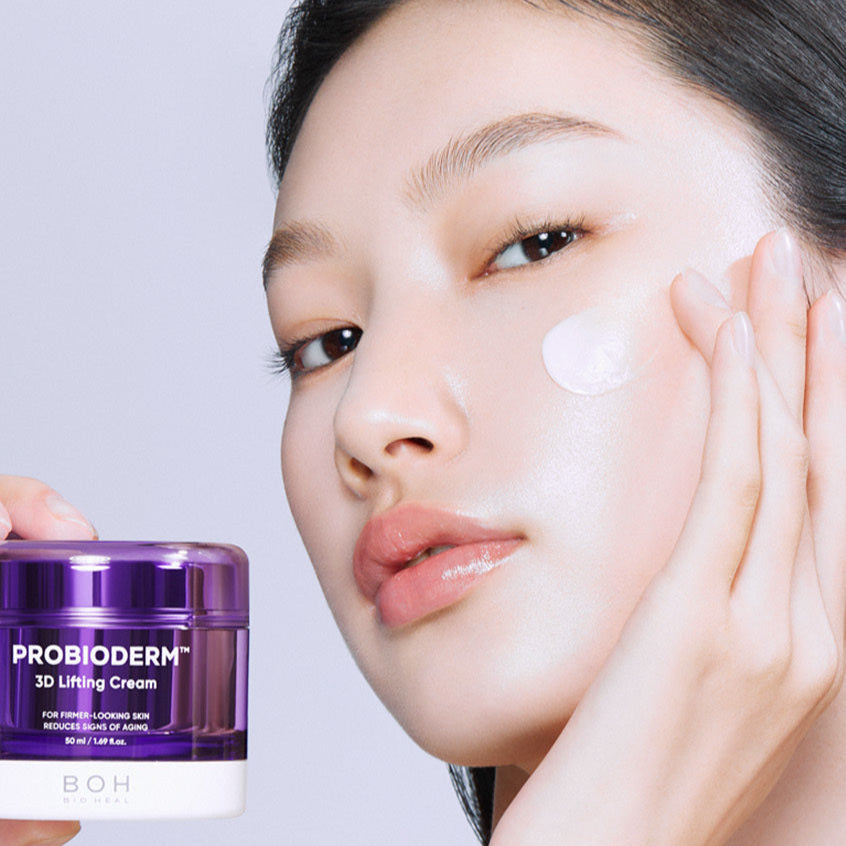 Woman applying BIO HEAL BOH Probioderm 3D Lifting Cream 50ml on her face for skin rejuvenation and lifting effect.