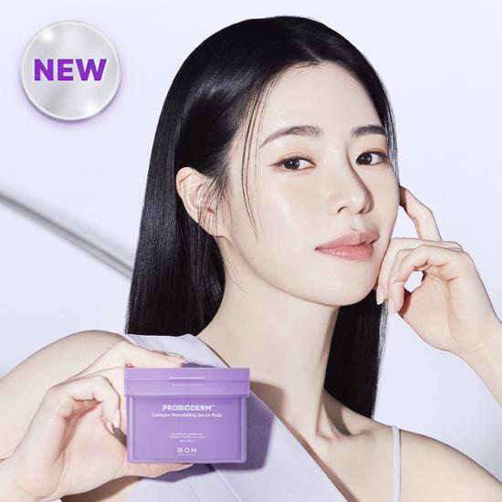 Woman holding BIO HEAL BOH Probioderm Collagen Remodeling Serum Pad 70 sheets with new badge in the background.